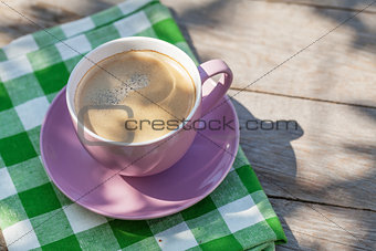 Coffee cup on garden table