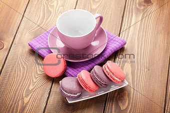 Colorful macaron cookies and coffee cup