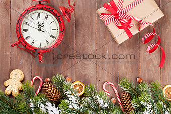 Christmas background with tree, alarm clock and gift