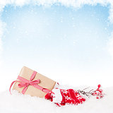 Christmas gift box in snow