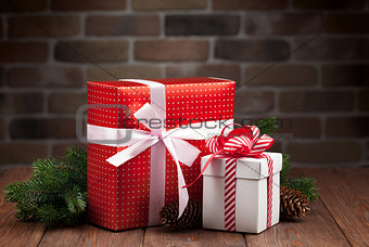 Christmas gift boxes and fir tree branch