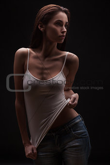 Full portrait of the sexy woman posing in studio
