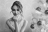 lovely girl with decorated xmas tree BW