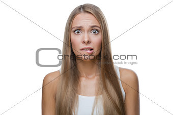 Portrait of shocked woman on white background