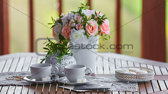 Nice breakfast in nature with a bouquet of flowers