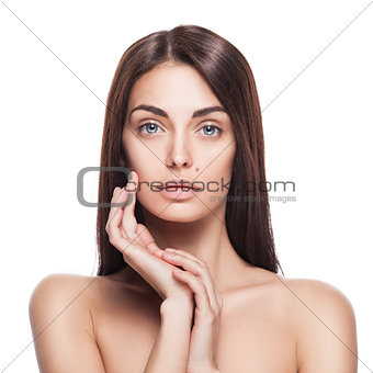 Portrait of female model with her hands near face
