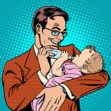 Happy father feeding newborn baby with milk