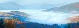 Autumn misty morning mountain panorama
