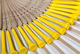 Typical Japanese hand fan made of bamboo and golf equipments