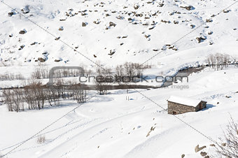 Isolated mountain hut in the snow
