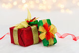 Red and green Christmas gift box with shiny ribbon