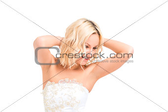 happy bride in a wedding dress posing on a white background