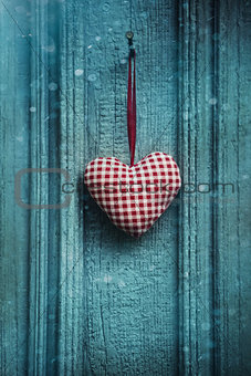 Christmas heart ornament hanging on door