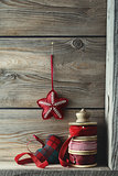 Ribbons and Christmas ornaments on wood shelf
