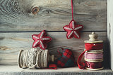 Ribbons and holiday ornaments on wood shelf