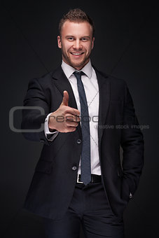 Portrait of young happy businessman