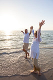 Senior Man & Woman Couple Sunset on Beach
