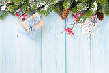 Christmas background with fir tree and gift