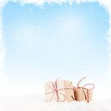 Christmas gift boxes in snow
