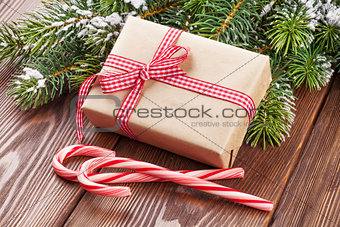 Christmas gift box, candy cane and tree branch
