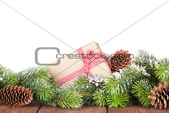 Christmas tree and gift box on wooden table