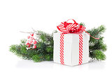Christmas gift box and fir tree branch