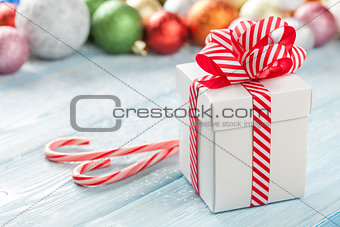 Christmas gift box and colorful baubles