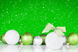 Christmas background with baubles and bokeh