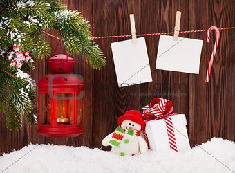 Christmas candle lantern, gift box and photos