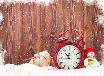Christmas gift box, snowman toy and alarm clock