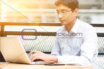 Indian businessman using laptop computer