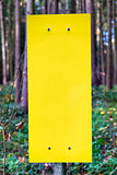 empty yellow sign in forest