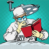 The surgeon before surgery is reading anatomy. Medicine and heal