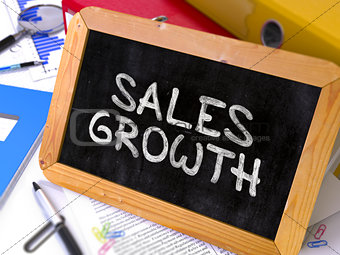 Handwritten Sales Growth on a Chalkboard.