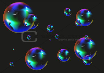 Multi colored soap bubbles on black background