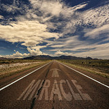 Conceptual Image of Road With the Word Miracle