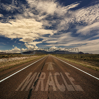 Conceptual Image of Road With the Word Miracle