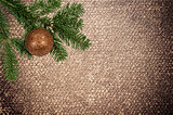 green branch with christmas ball on canvas background