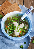 Hot chicken and sorrel soup with herbs