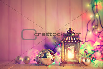 Christmas still life with lamp garland and balls