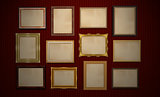 Gallery, blank frames on red wall