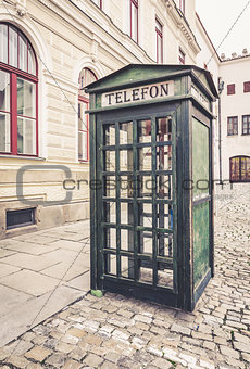 Old retro street public telephone booth