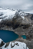 The lake Bispevatnet, blue and calm sorounded by mountains and glaciers