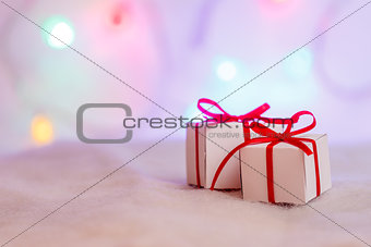 Decorated Christmas gifts on abstract background