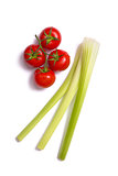 Bunch of fresh tomatoes and celery sticks 