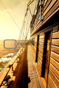 Wooden sailboat in sea