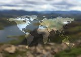 Polygonal world map on blurred landscape background