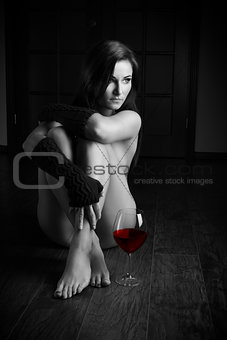 sexy nude girl with glass of red wine BW shot