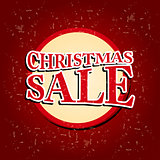 christmas sale in circular red banner over old paper background