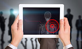 Person holding tablet with x-ray of mans shoulder
